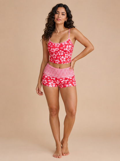 Peppermolly two-piece swimsuit with hibiscus print.